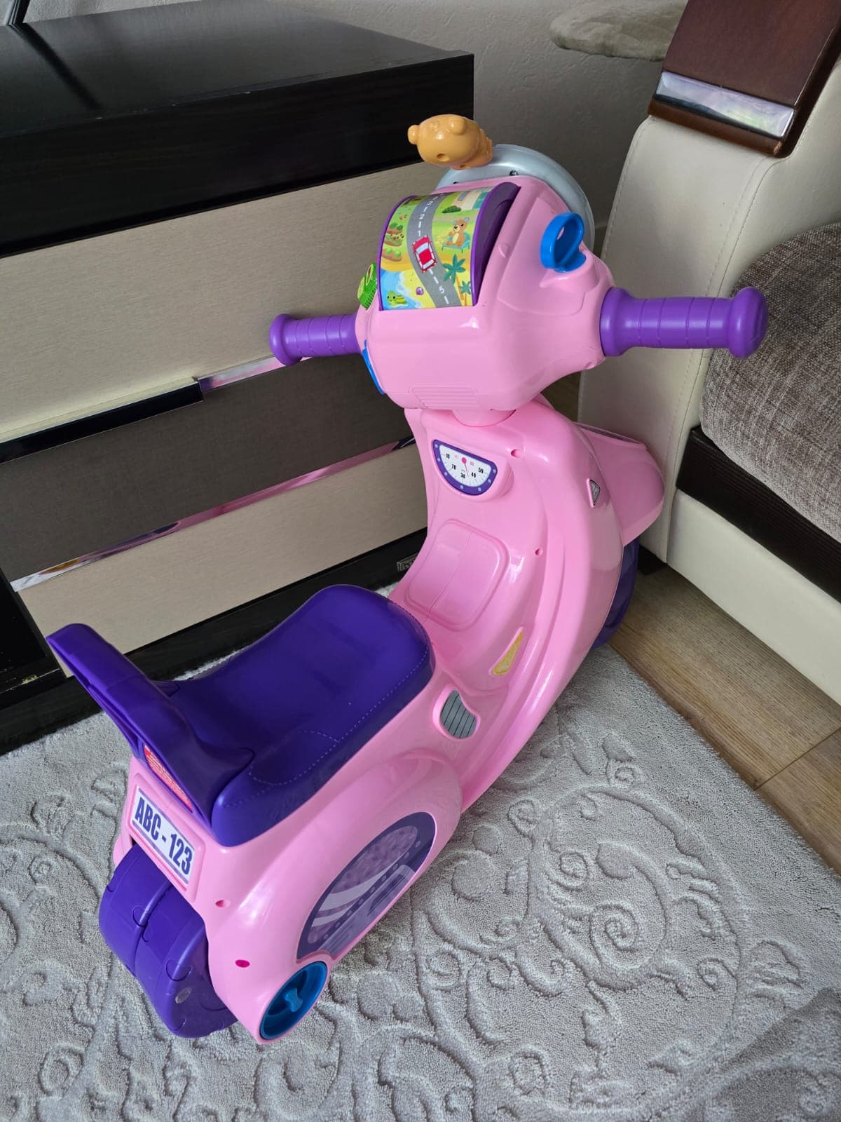 Pink and purple ride-on scooter toy for toddlers